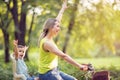 Family cycling outdoors Ã¢â¬â mother and son on bicycles in park Royalty Free Stock Photo